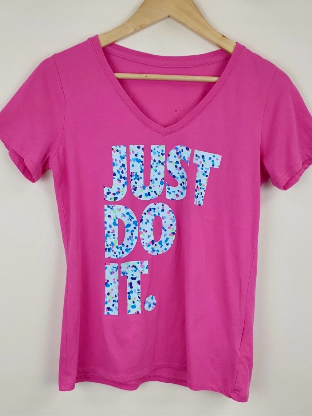 Nike Women’s Pink V-Neck Tee with Graphic "Just Do It."